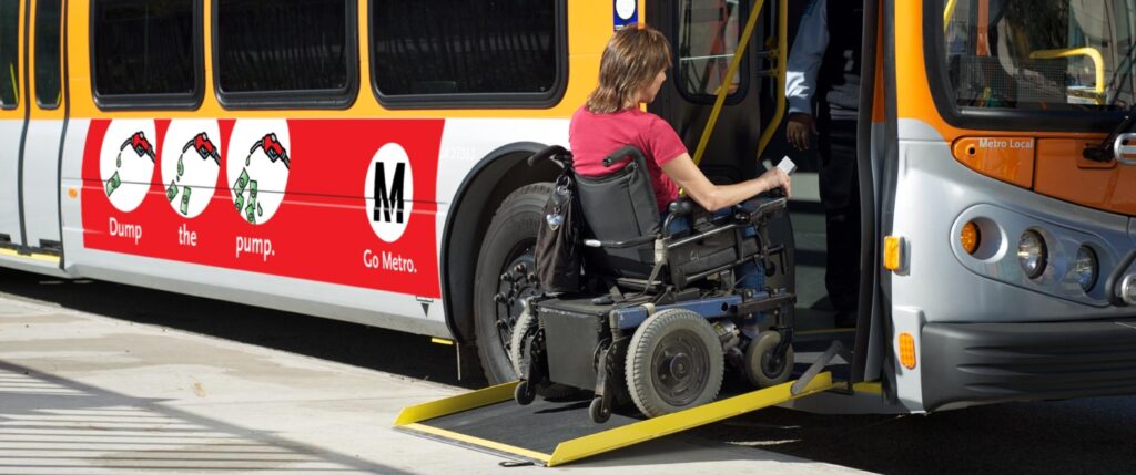 Passenger in wheelchair boarding a Metro Local Bus using a ramp.