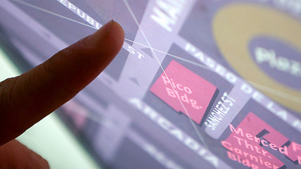 Finger pointing at Metro map.