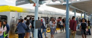 Riders entering and exiting Metro Rail Santa Monica Station.