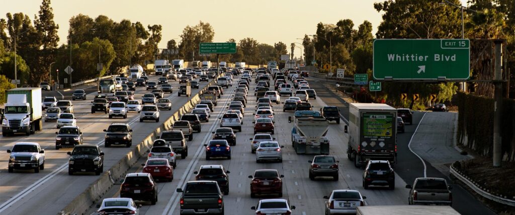 Vehicles on a crowded freeway (both directions).