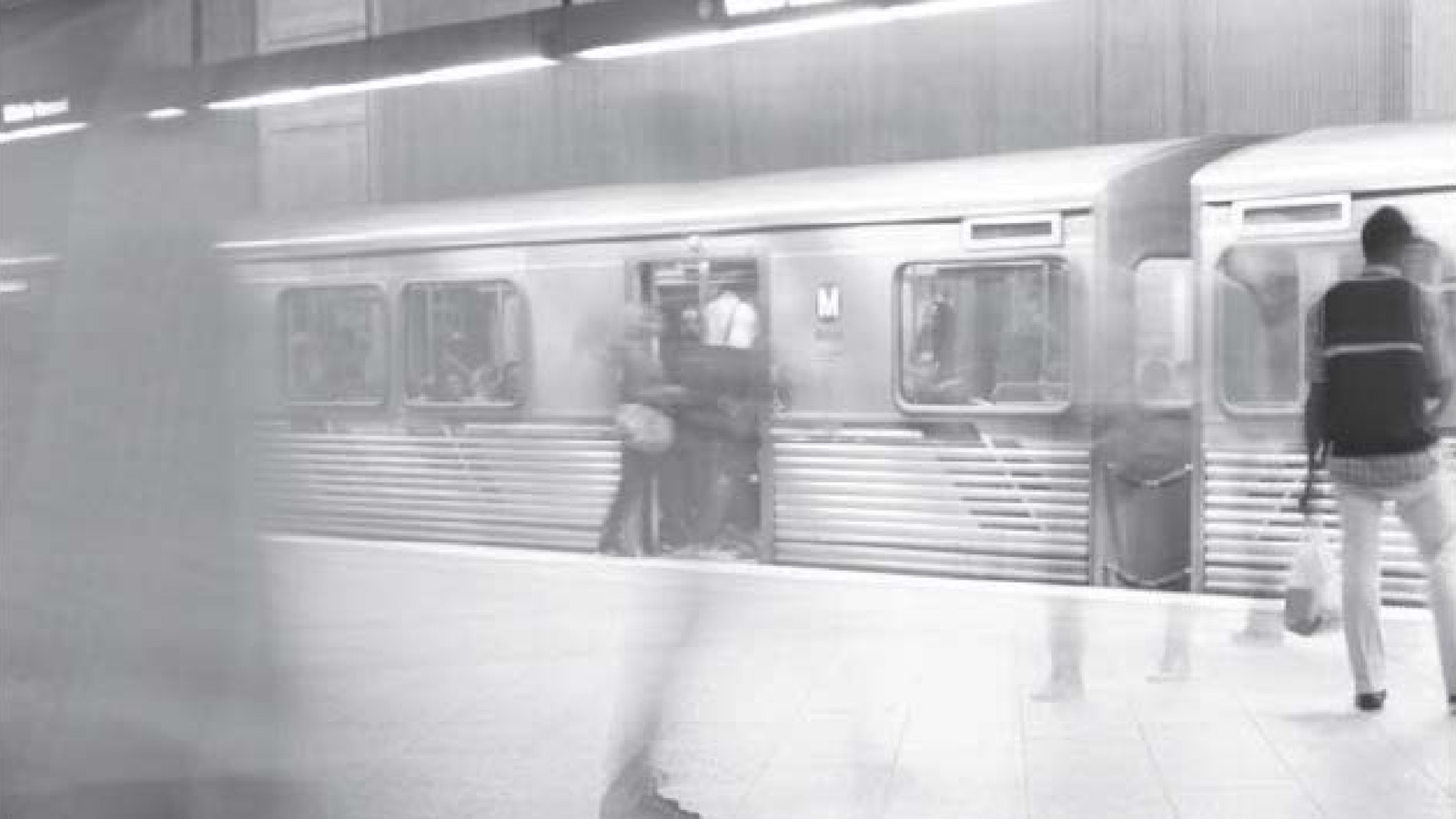 Metro Rail station with passengers.