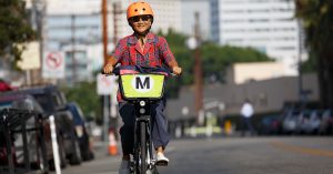 Person riding Metro Bike Share bicycle in Downtown Los Angeles.