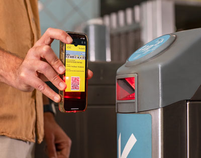 Customer at TAP machine scanning a Go Metro to Hollywood Bowl ticket.