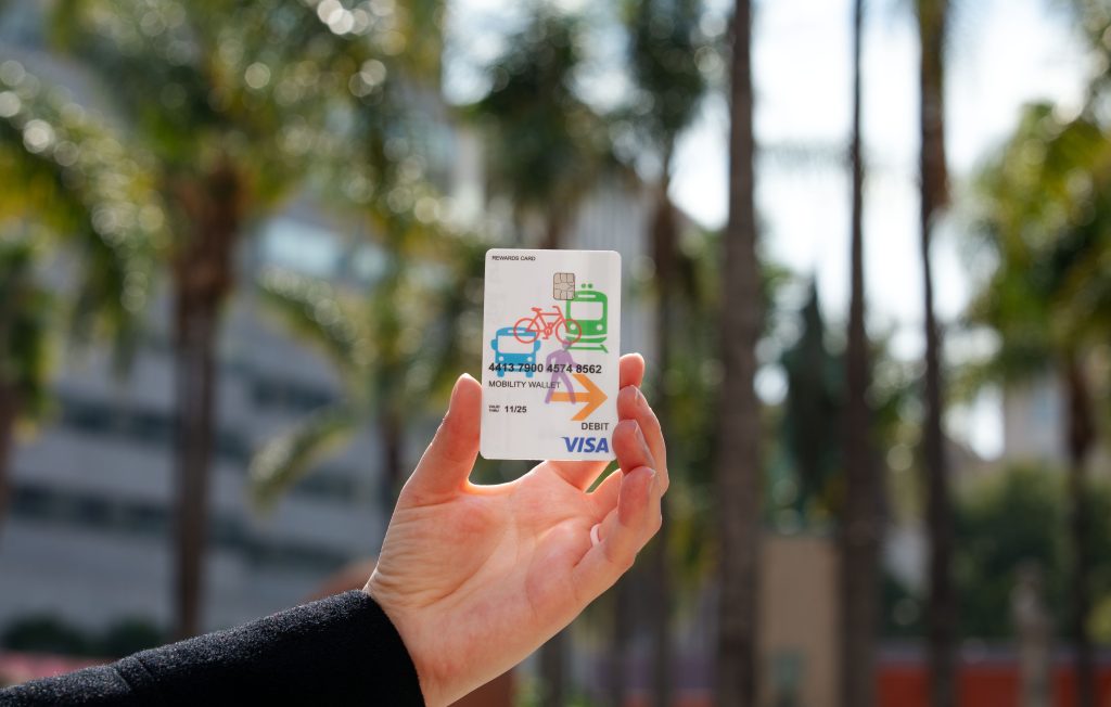 Hand holding up a Mobility Wallet card